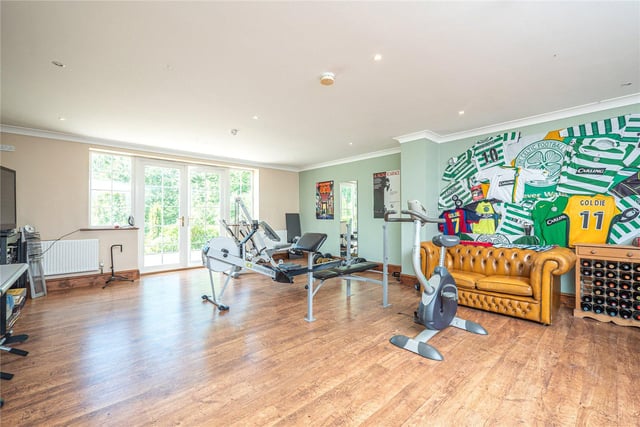 The property features six reception rooms in total, including two which are currently used as a gym area and a games room, which opens onto the rear gardens via French doors.