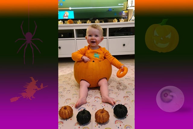 Madeline Lamb has been popped into a pumpkin for her first Halloween
