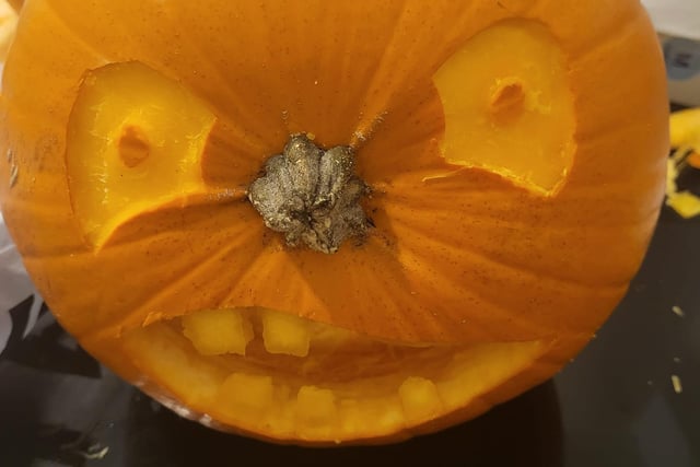 Kirsty Louise carved a face into the top of a pumpkin so that the stem made a nose.