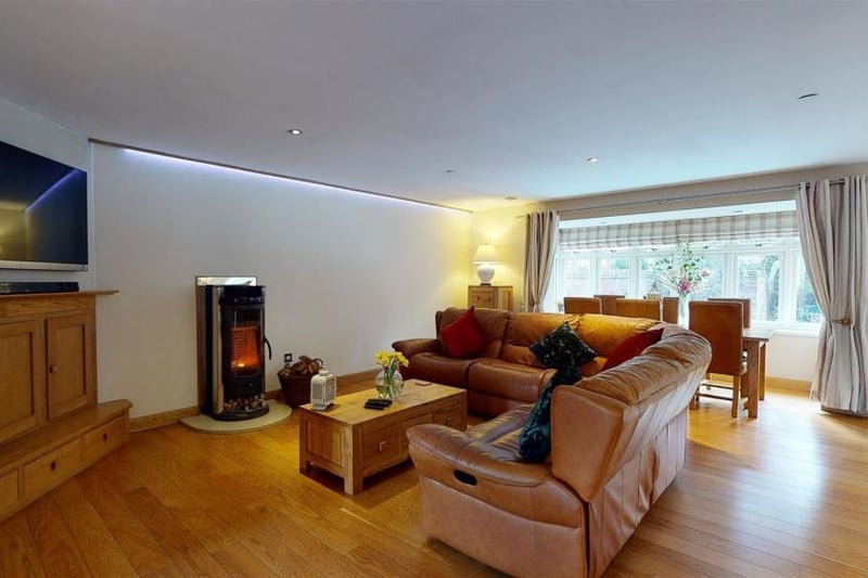 The free standing log burner adds an extra cosy touch to the living room.