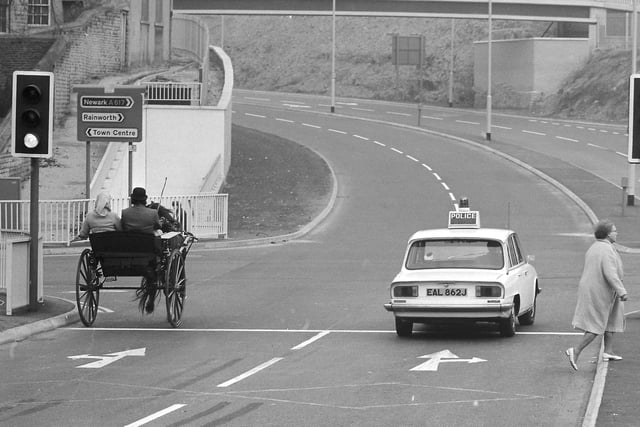 Some of the first vehicles to use the new road as it opened on October 1 1972