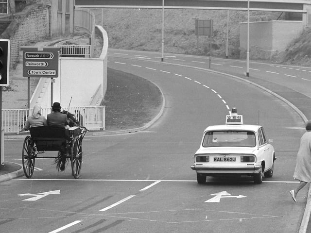 Some of the first vehicles to use the new road as it opened on October 1 1972