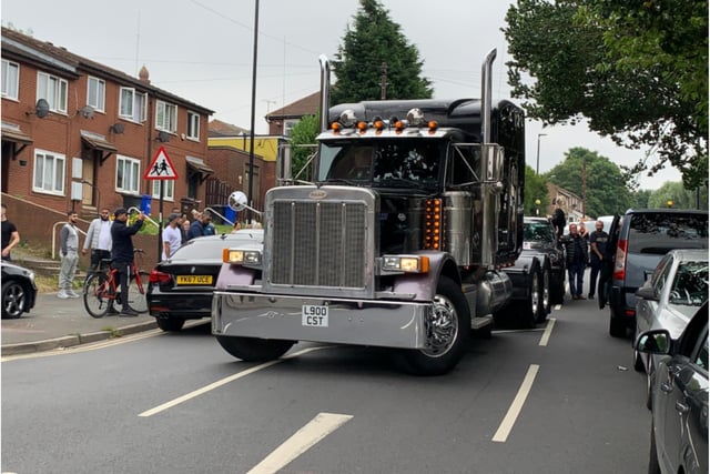 A huge truck was used to carry Mr Collins' casket for part of the procession.