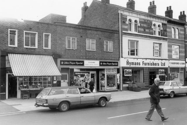 Ellesmere Road, in Burngreave, Sheffield, in August 1985, showing shops including Walter Wild fishmonger, K. A. Clarke newsagent and tobacconist, and Hymans furnishers.