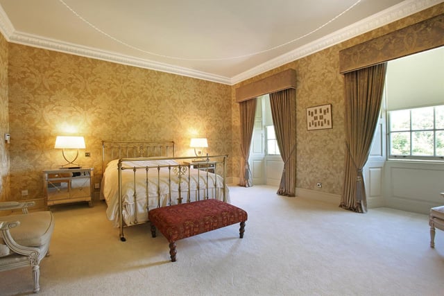 This bedroom enjoys a dual aspect with views over the grounds