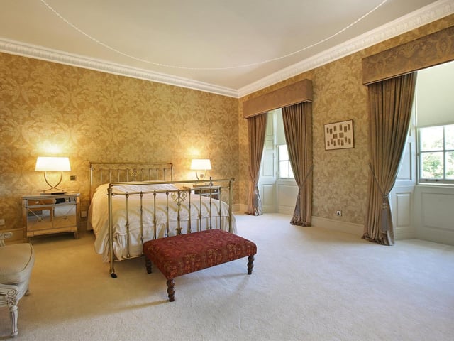 This bedroom enjoys a dual aspect with views over the grounds