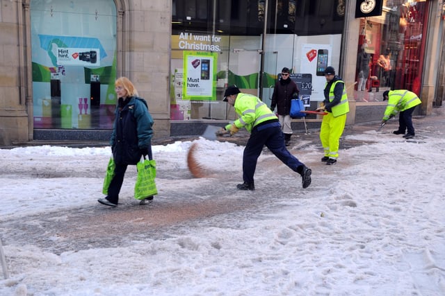 Council workmen gritting 48hours after the heavy snow in Sheffield's major shopping street,  December 3,  2010