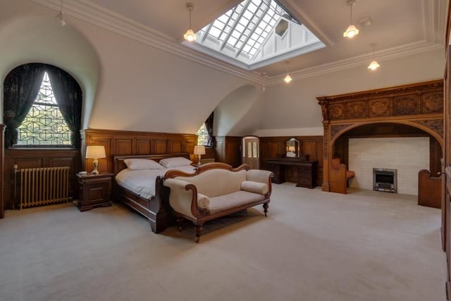 The main bedroom of the Glasgow property can only be described as beautiful. Note the skylight, which helps its bright appearance, but the room's most unusual feature is a sit-in fireplace.