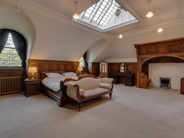 The main bedroom of the Glasgow property can only be described as beautiful. Note the skylight, which helps its bright appearance, but the room's most unusual feature is a sit-in fireplace.
