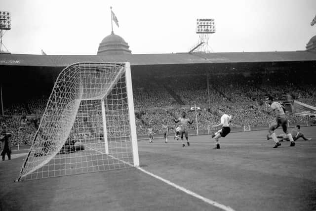 File photo dated 09-05-1956 of Colin Grainger (white shirt) scores England's fourth goal of the game from a header during the friendly against Brazil. PA/PA Wire.