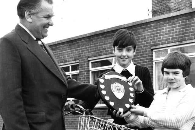 South Tyneside road safety officer Ken Shipley, presents Graham Pude, 10, and Andrea Raynsford, 11, of Biddick Hall Junior School, with the Tyne and Wear National Cycling Proficiency Shield. Does this bring back happy memories?