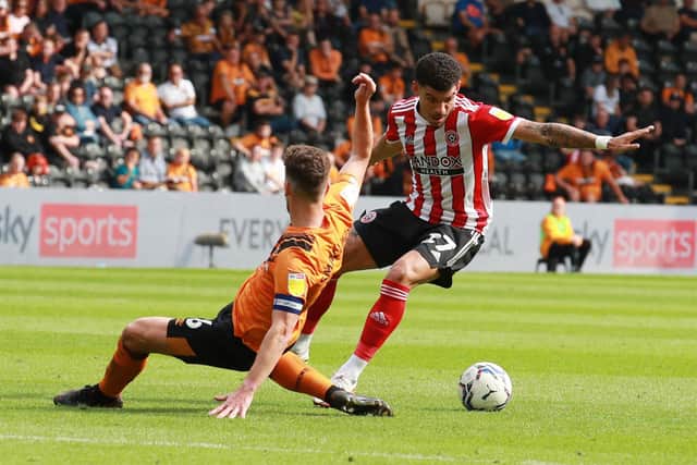 Morgan Gibbs-White of Sheffield Utd skips past Richard Smallwood of Hull City during the Sky Bet Championship match at the MKM Stadium, Kingston upon Hull. Picture credit should read: Simon Bellis / Sportimage