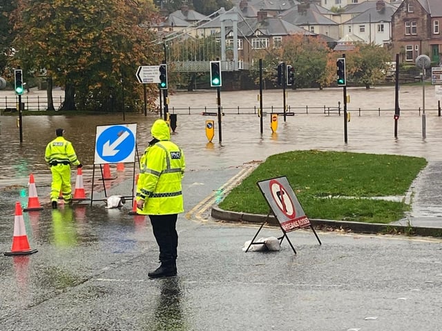 An image from Police Scotland reporting that the River Nith in Dumfries has burst its banks and flooded Whitesands.