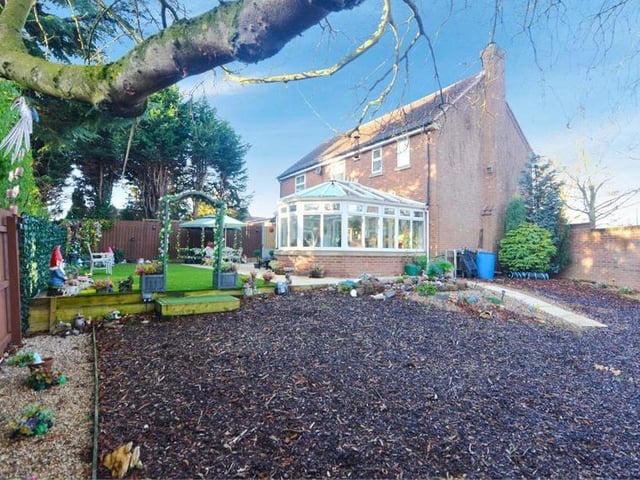 Here is that wood-chipped area in the back garden. There are plant beds too, but the garden is so spacious and flexible, it could be adapted in any way you like.