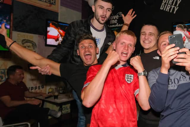 England fans celebrate in The Common Room in Sheffield after the England v Denmark Euros semi-final