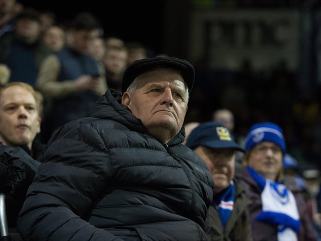 Pompey fans look disappointed as Arsenal score their second goal.