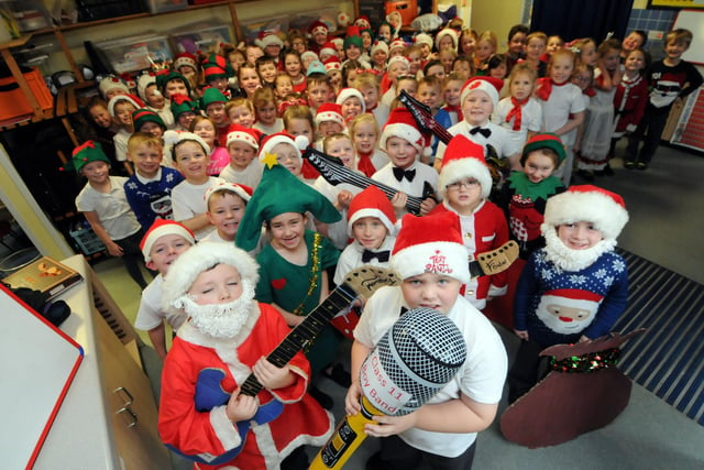 Grange Primary School pupils wearing christmas jumpers and different costumes in 2014. Who can tell us more?