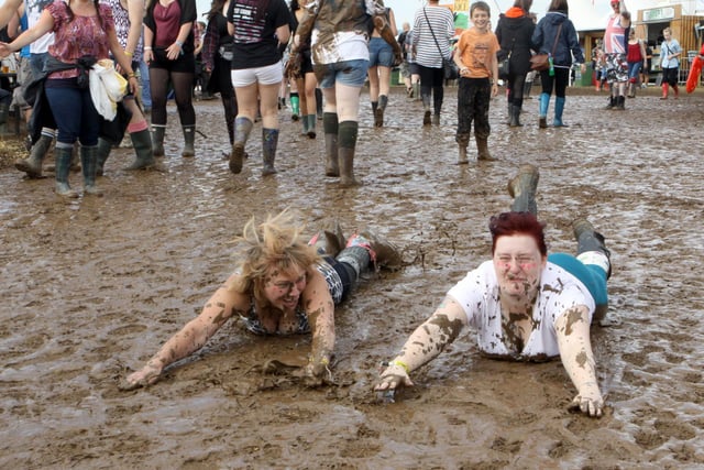 Leonie Arthurs and Helen Shawcross from Whaley Bridge slide in the mud in 2014