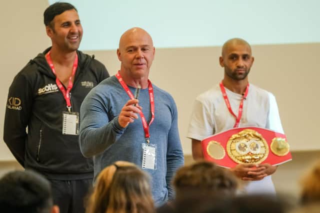 IBF World Featherweight Champion Kid Galahad returns to Hinde House School to show off his belt