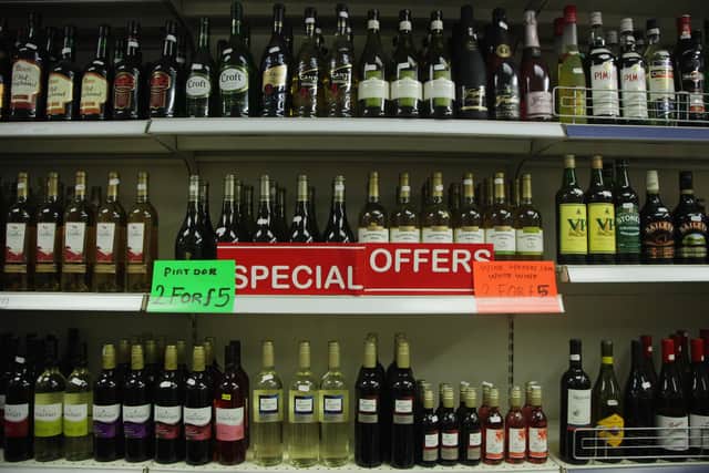 A sign displaying special offers on alcohol hangs on the shelves of an Off Licence  (Photo by Dan Kitwood/Getty Images)