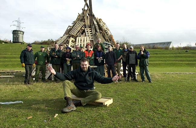 Building the bonfire is Simon Dore and colleagues at the  Don Valley Bowl After Dark event, November 4, 2003