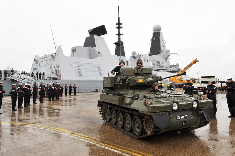 HMS Dragon's departing Commanding Officer, Commander Darren Houston leaves the ship in a Tracked Armoured Fighting Vehicle provided by its affiliated regiment, The Royal Welsh on the 20th December 2012. HMS Dragon's Commanding Officer, Commander Darren Housten, handed over Command of the ship to Captain Ian Lower.
Commander Housten has been the ship's Commanding Officer since April 2011.
