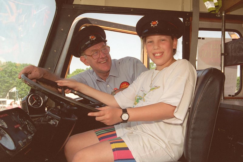 Astrid October gets some driving lessons from Dave Purcell of the Sheffield Fire Museum (now the National Emergency Services Museum) at the 1997 Sheffield Motor Show