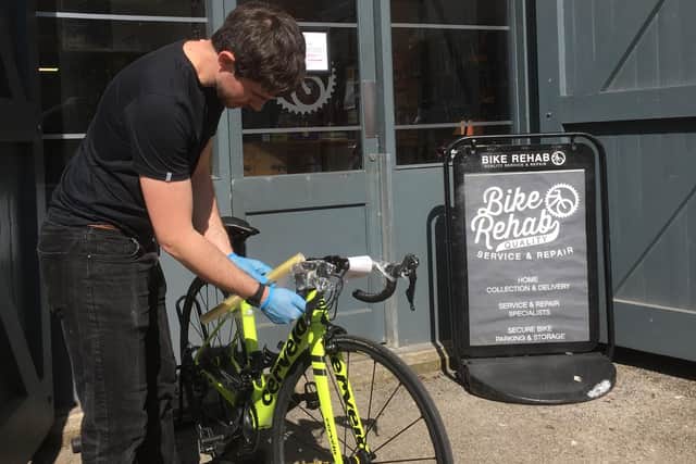 Wrapping handlebars at Bike Rehab.
