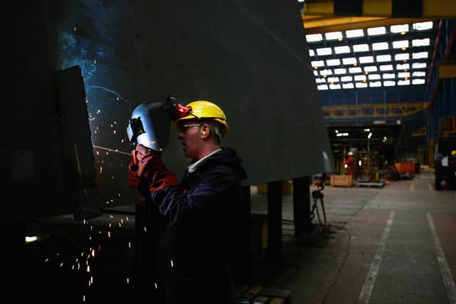 GLASGOW, UNITED KINGDOM - JULY 03:  A welder works on a type 45 destroyer being built in Govan shipyard on July 3, 2008 in Glasgow, Scotland. Defence Secretary Des Browne, visited the yard to announce a new Ministry of Defence contract, worth an estimated ?3.2 billion to build the UK's biggest ever aircraft carriers.  (Photo by Jeff J Mitchell/Getty Images)