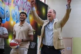 Tyrone Mings, left, with Prince William, at the Reach Up Youth project in Sheffield, shooting basketball hoops