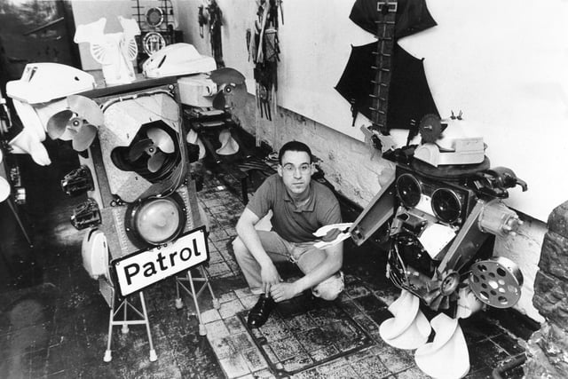 Sculptor George Giles in the middle of some of his creations - modern art sculptures from the everyday rubish that everyone else throws away. An exhibition of his work was on show at the Walkley Institute in June 1988