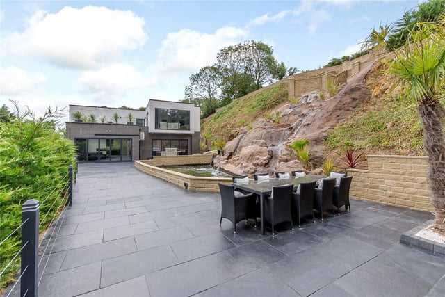 The stunning outdoor area offers a wealth of space for entertaining, with several areas available to relax.