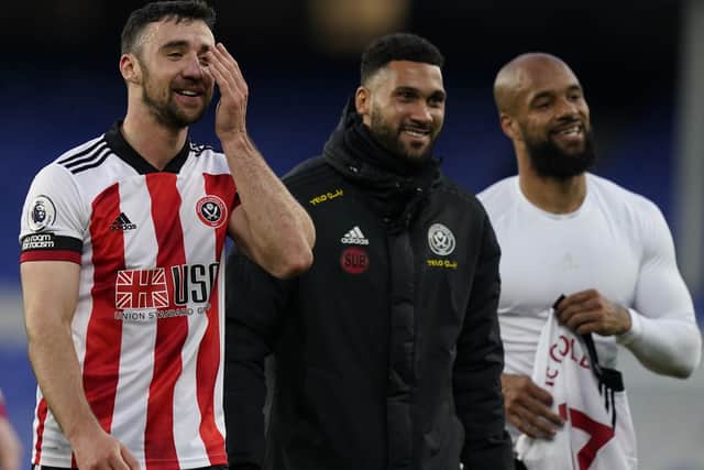 Liverpool, England, 16th May 2021. Enda Stevens Wes Foderingham and David McGoldrick of Sheffield Utd walk off smiling after winning 1-0  during the Premier League match at Goodison Park, Liverpool. Picture credit should read: Andrew Yates / Sportimage