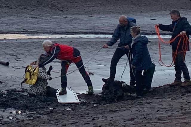 Members of Edale Mountain Rescue are pictured pulling a stricken walker from the mud at the Derwent reservoirs. PIctures: Edale Mountain Rescue