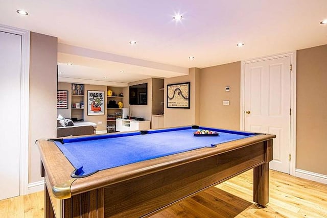 The basement has been converted into a games room with utility space and underfloor heating.