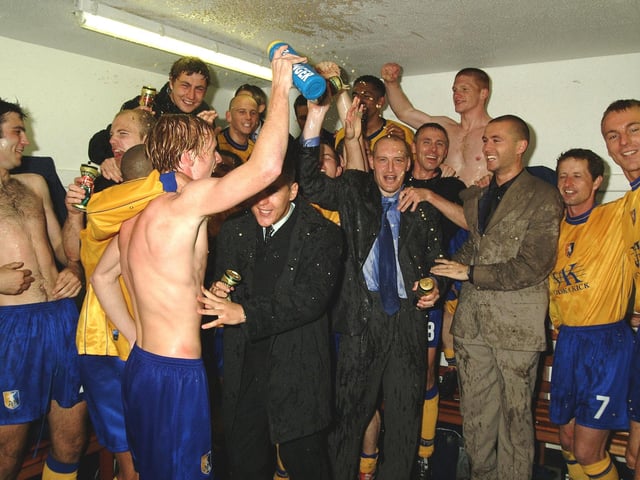 Dressing room celebrations as Stags head for Division Two.
