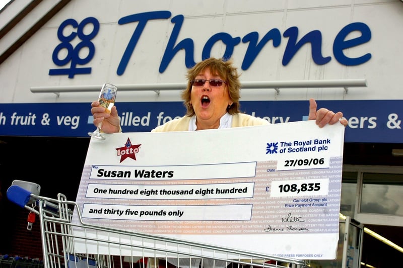 Susan Waters, aged 58, from Thorne, is shown celebrating her £108,835 Lotto win at the Co-op where she bought her ticket in October 2006
