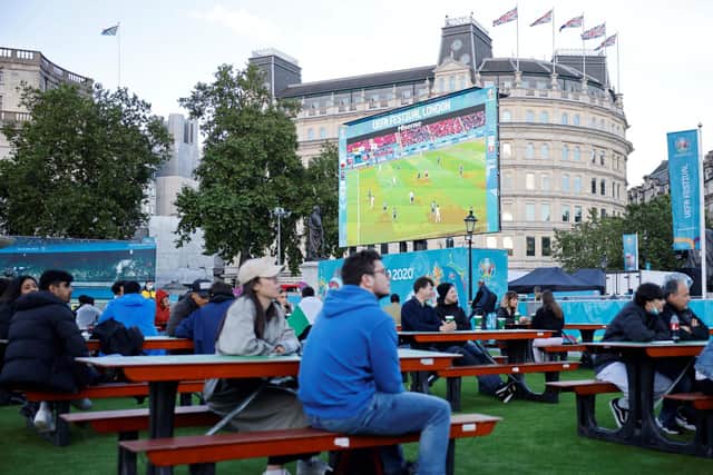 Football fans watch the UEFA EURO 2020 semi-final football match between Spain and Italy, at the FanZone in Trafalgar Square, central London on July 6, 2021. (Photo by Tolga Akmen / AFP) (Photo by TOLGA AKMEN/AFP via Getty Images)