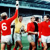 Gordon Banks on the pitch with Bobby Moor, Peter Thompson and Martin Peters after the World Cup victory
