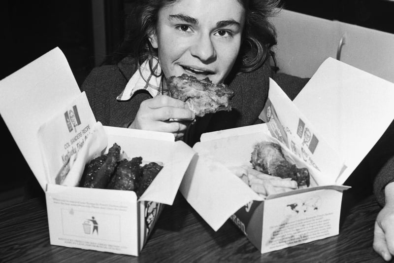 A customer with boxes of fried chicken at a Kentucky Fried Chicken (KFC) takeaway in Edinburgh, January 1980