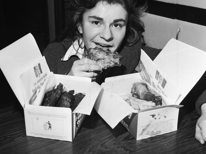 A customer with boxes of fried chicken at a Kentucky Fried Chicken (KFC) takeaway in Edinburgh, January 1980