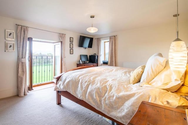 The master bedroom is a good size with a separate walk-in wardrobe and an en suite shower room.