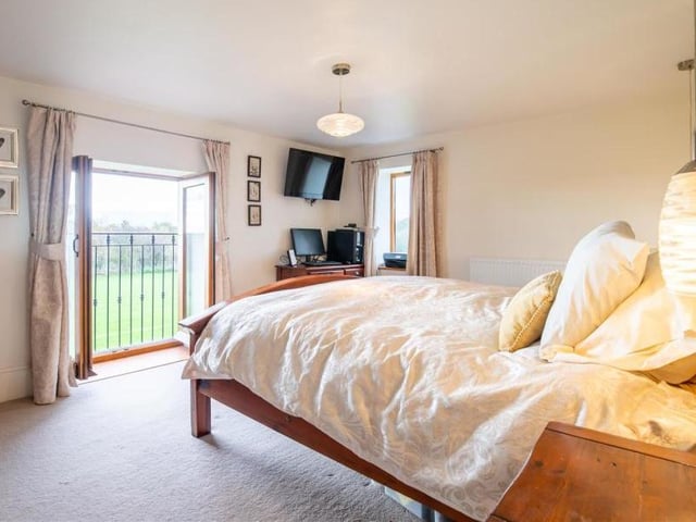 The master bedroom is a good size with a separate walk-in wardrobe and an en suite shower room.