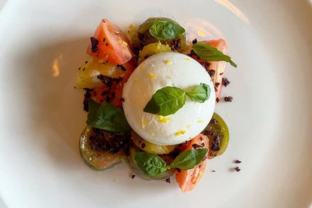 Burrata cheese served with heritage tomatoes and an olive crumb.