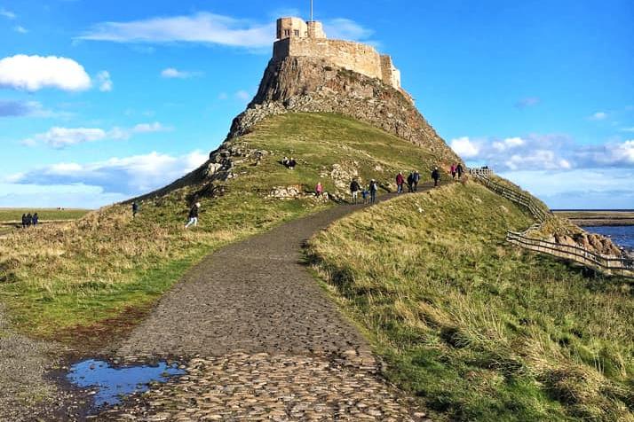 A love heart puddle in front of Lindisfarne Castle.