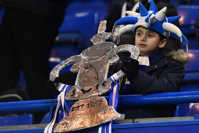 A young Wednesdayite holds a home-made tinfoil FA Cup before the fourth round tie at Chelsea in January 2019.