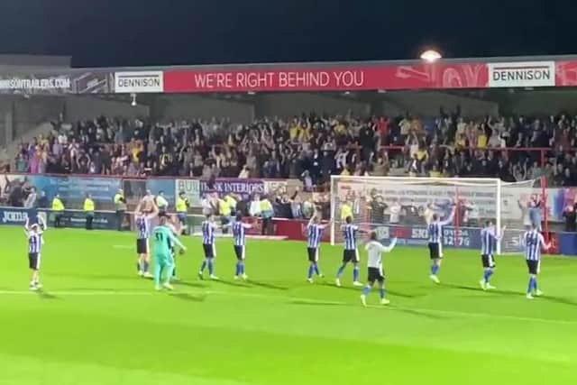 Sheffield Wednesday players celebrate with their fans after their 3-0 win over Morecambe.