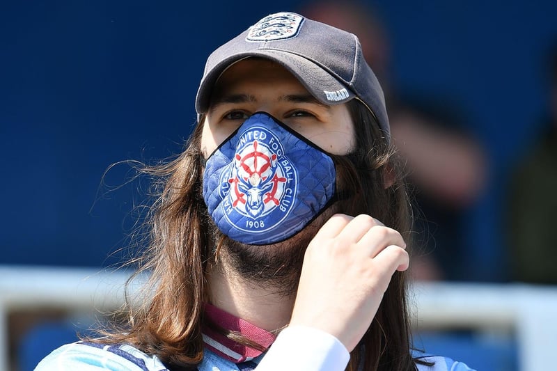 Pools fan wearing Hartlepool United face mask.