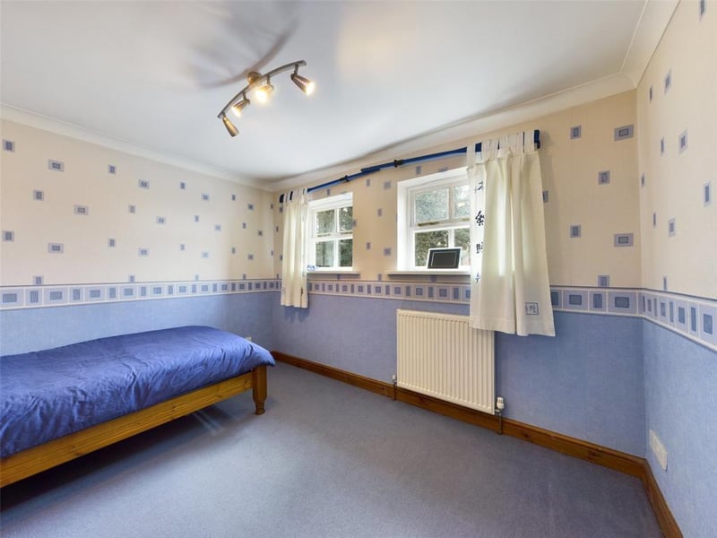 Bedroom three with two front facing windows