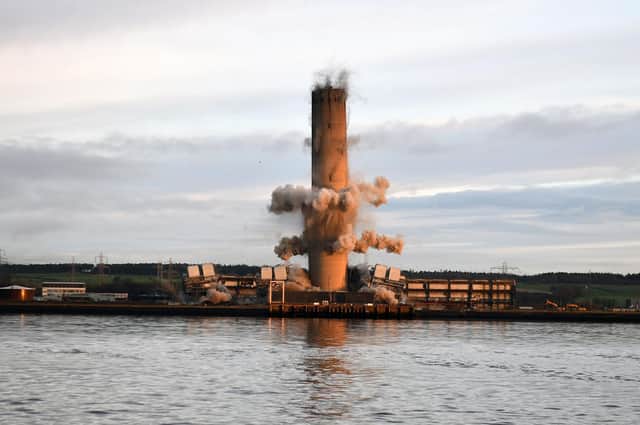 The 600ft chimney at the site of Scotland's last remaining coal fired power station came down this morning.